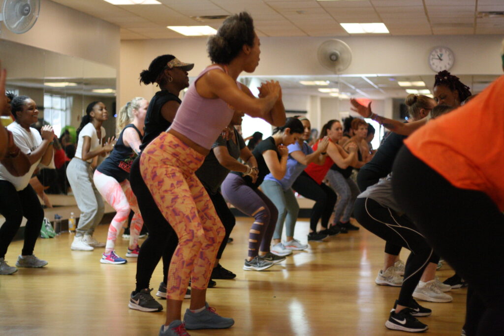 women squatting in zumba